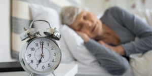 senior woman practicing good sleep hygiene