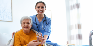 senior woman smiling with her nurse